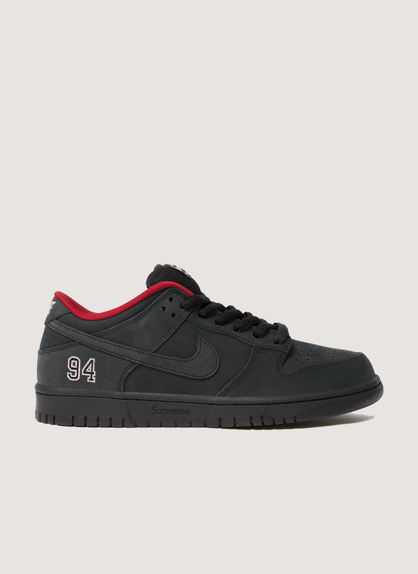 Nike Supreme Supreme SB 94 Dunk Low Black Red shoes with leather upper, rubber outsole with Zoom Air unit, padded mesh tongue, co-branded footbed with mesh collar and tongue lining, 3M reflective swoosh, metallic woven logo label on tongue, side profile view Supreme SB 94 Dunk Low Black - Authenticated Sneakers | Pieces Los Angeles