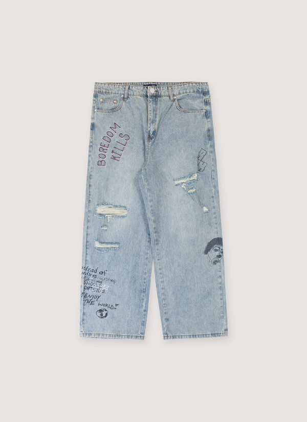 Boredom Kills Scribble Denim Jeans Indigo Blue with diestressings, tears, and and text all over, front view Scribble Denim Indigo - Authenticated Jeans | Pieces Los Angeles