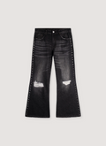 Vague Studios '85 Flared Denim jeans Washed Black with rips on knees and studs all over Vague Studios 85 Flared Denim Washed Black - Image 1 | Authenticated at Pieces Los Angeles