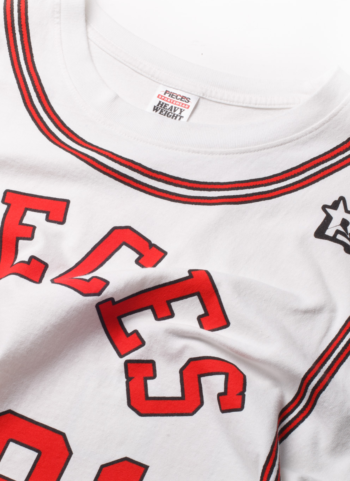 Pieces 91 Jersey Tee White and Red front view close up of the neckline with the tag and shirt details Pieces 91 Jersey Tee White - Image 3 | Authenticated at Pieces Los Angeles