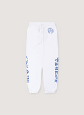 Chrome Hearts Horseshoe Logo Sweatpants White Blue with printed logo by the waist and printed logos on the side of the legs, adjustable drawstring waist, elastic cuff ankle opening, front view Chrome Hearts Horseshoe Logo Sweatpants White Blue - Image 1 | Authenticated at Pieces Los Angeles