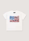 Pieces No Vacancy GBP Rhinestone Tee Shirt Off White garment dyed with screen printed logo of the American flag, cut and sewn garment, boxy cropped fit, handset cross rhinestone pattern, hand distressed details, front view Pieces GBP Rhinestone Tee Off White - Image 1 | Authenticated at Pieces Los Angeles