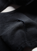Pieces Alexander Denim Washed Black jeans close up shot of the distressing details Pieces Alexander Denim Washed Black - Image 3 | Authenticated at Pieces Los Angeles