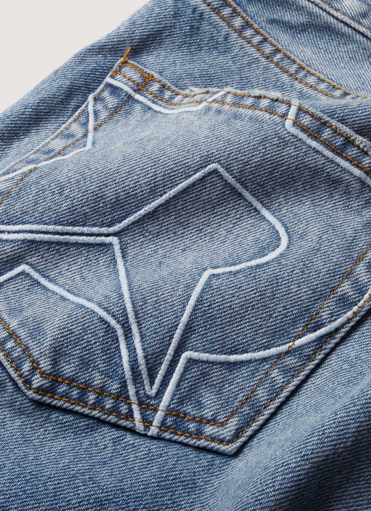 Pieces Alexander Denim Washed Indigo Blue Jeans close up of back pocket stitching with P star design