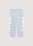 Sp5der Worldwide Beluga Sweatpants Heather Grey with white graphic text on the legs, and small white and black stars all over, front view