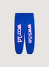 Sp5der Worldwide Beluga Blue Sweatpants with Pink Graphic text on the legs, front view