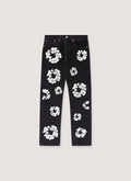 Denim Tears Cotton Wreath Denim Jeans Black with white wreath flower graphics all over, front view Denim Tears Cotton Wreath Jeans Black - Image 1 | Authenticated at Pieces Los Angeles