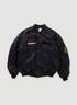 Vetements Police Bomber Black (Pre-Owned) Jacket with cotton and nylon, velcro attachable embroidered patch details, snap and zip front closure, zippered outer pockets, snap inner pockets, oversized, front view