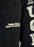 Better With Age Fuck You Sweatpants Black with white embroidered logos and screen print text that says Fuck You, constructed with recycled and re-milled fabric, heavyweight cotton fleece, close up view of text on front Better With Age Fuck You Sweatpants Black - Image 3 | Authenticated at Pieces Los Angeles