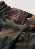 Pieces Back Pleat Shorts Dirty Camo distressed, close up view of back patch Pieces Back Pleat Shorts Dirty Camo - Image 5 | Authenticated at Pieces Los Angeles