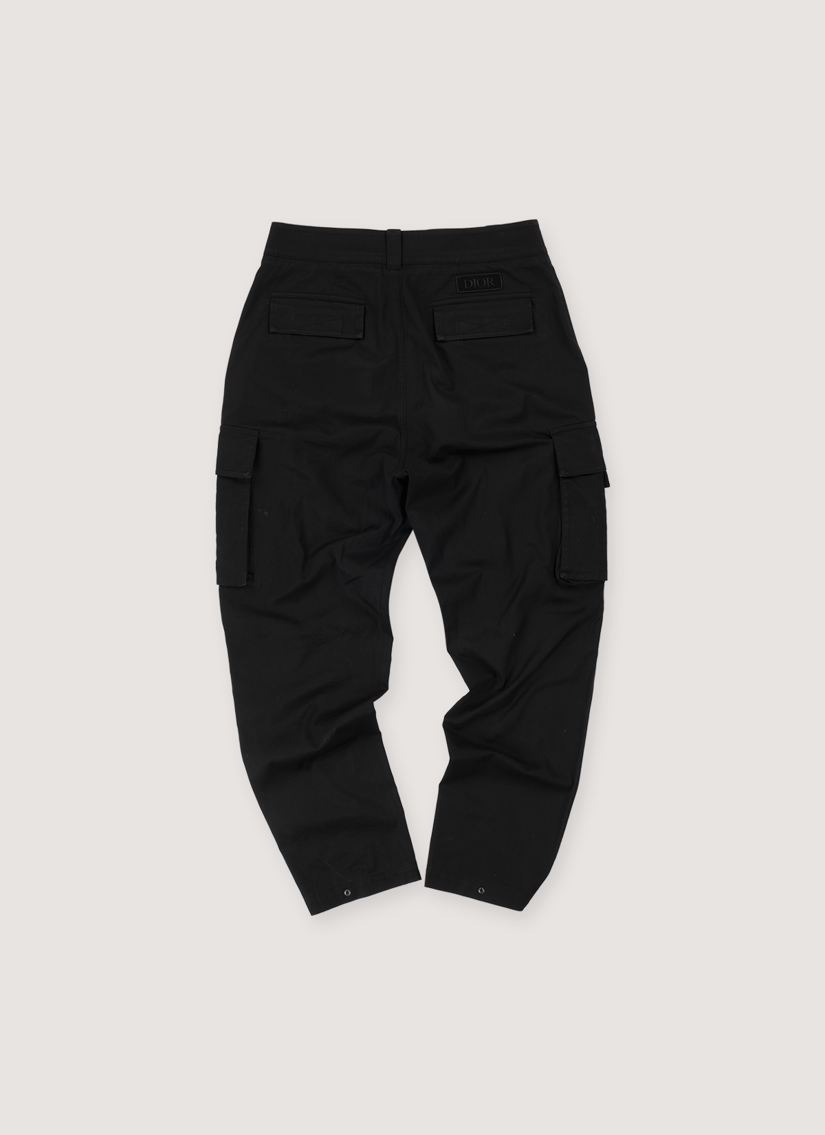 Dior Cargo Pants Black Gabardine (Pre-Owned) zip and hook closure, Dior soft patch back, snap button pockets and ankles, side cargo pockets, side slit pockets, front view Dior Cargo Pants Black Gabardine (Pre-Owned) - Image 2 | Authenticated at Pieces Los Angeles