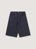Basketcase Gallery Breacher Denim Shorts Indigo Cheetah Jorts with 5 pocket design, cheetah print fabric back pockets, leather back tab, elongated fit, front view Basketcase Gallery Breacher Denim Shorts Indigo Cheetah - Image 1 | Authenticated at Pieces Los Angeles