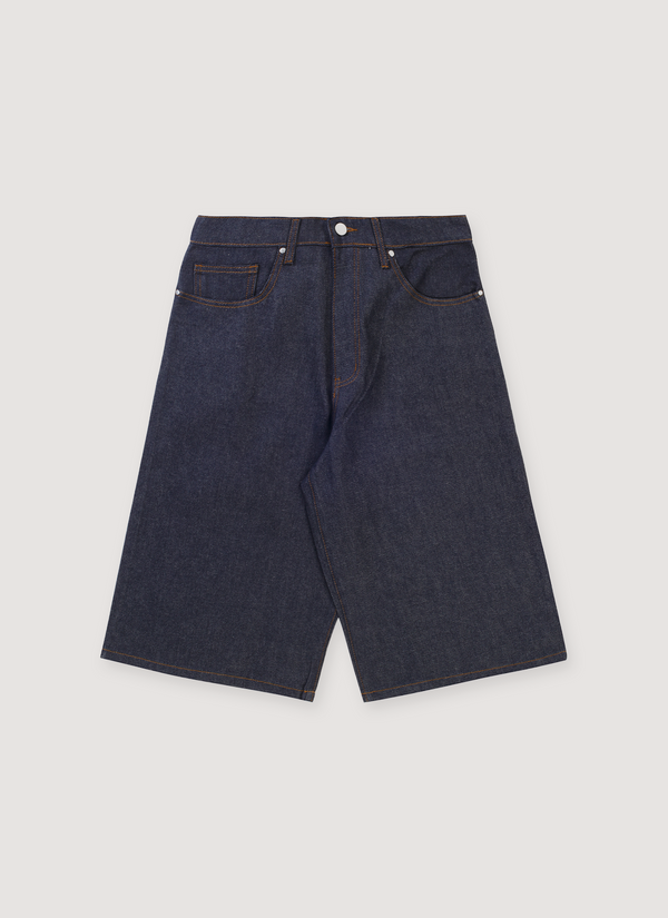 Basketcase Gallery Breacher Denim Shorts Indigo Cheetah Jorts with 5 pocket design, cheetah print fabric back pockets, leather back tab, elongated fit, front view Breacher Denim Shorts Indigo Cheetah - Authenticated Shorts | Pieces Los Angeles