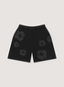 Denim Tears Mono Wreath Sweatshorts Black with monochrome graphic wreath flower graphics all over, front view