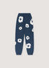 Denim Tears Cotton Wreath Sweatpants Navy, cuffed with white wreaths flowers all over, front view