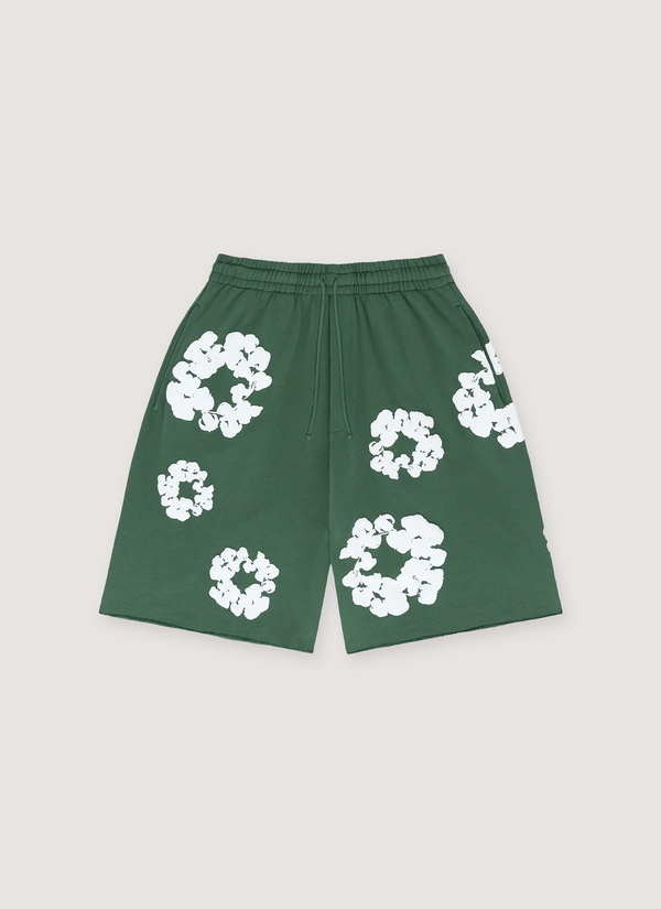 Denim Tears Cotton Wreath Sweatshorts Green with white wreath flowers all over, front view Cotton Wreath Sweatshorts Green - Authenticated Shorts | Pieces Los Angeles
