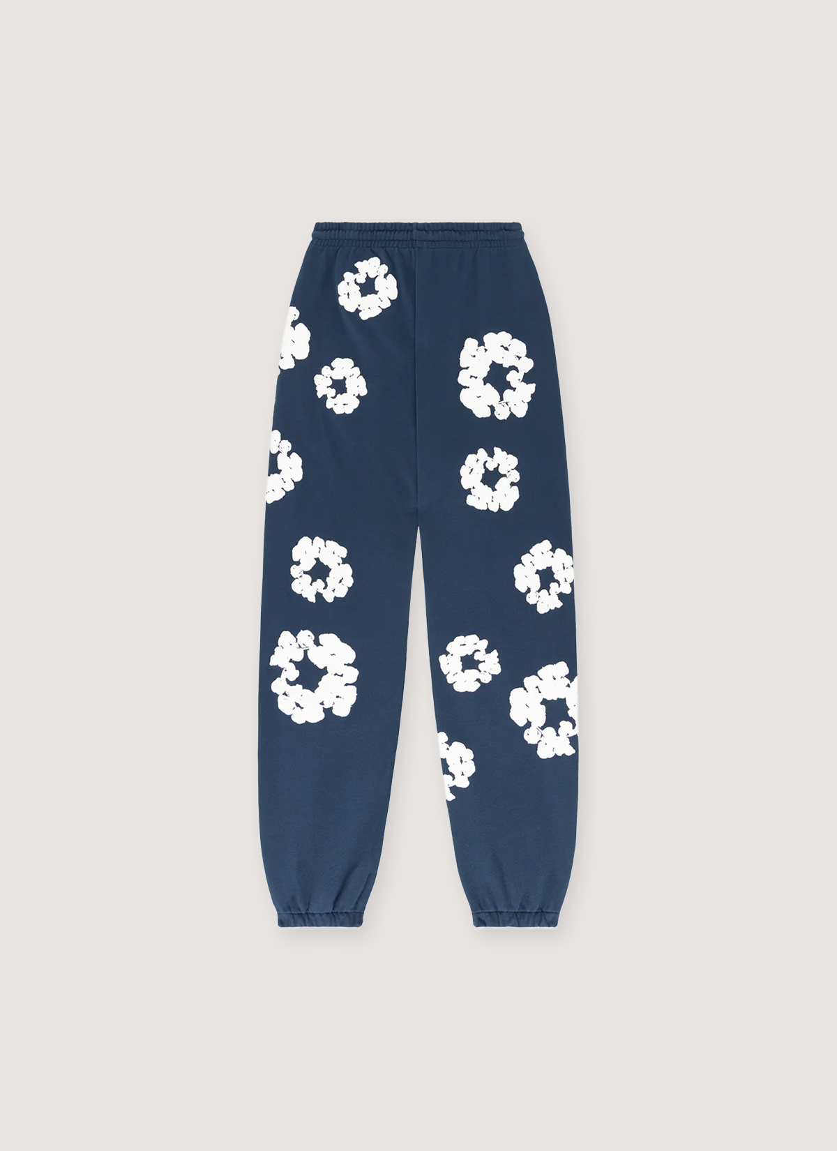 Denim Tears Cotton Wreath Sweatpants Navy, cuffed with white wreaths flowers all over, back view