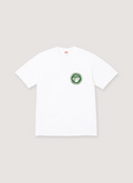 Supreme Devotion white tee shirt with small green logo front view Supreme Devotion Tee - Image 4 | Authenticated at Pieces Los Angeles