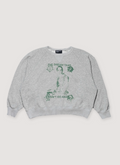 Enfants Riches Déprimés The Dream That Won't Go Away Raglan Sweatshirt Crewneck Heather Grey cotton fleece with ribbed cuff, ribbed neck, ribbed hem, with green vintage graphic and text, front view Enfants Riches Déprimés The Dream That Won't Go Away Raglan Sweatshirt Heather Grey - Image 1 | Authenticated at Pieces Los Angeles