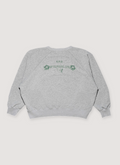 Enfants Riches Déprimés The Dream That Won't Go Away Raglan Sweatshirt Crewneck Heather Grey cotton fleece with ribbed cuff, ribbed neck, ribbed hem, with green vintage graphic and text, back view Enfants Riches Déprimés The Dream That Won't Go Away Raglan Sweatshirt Heather Grey - Image 2 | Authenticated at Pieces Los Angeles