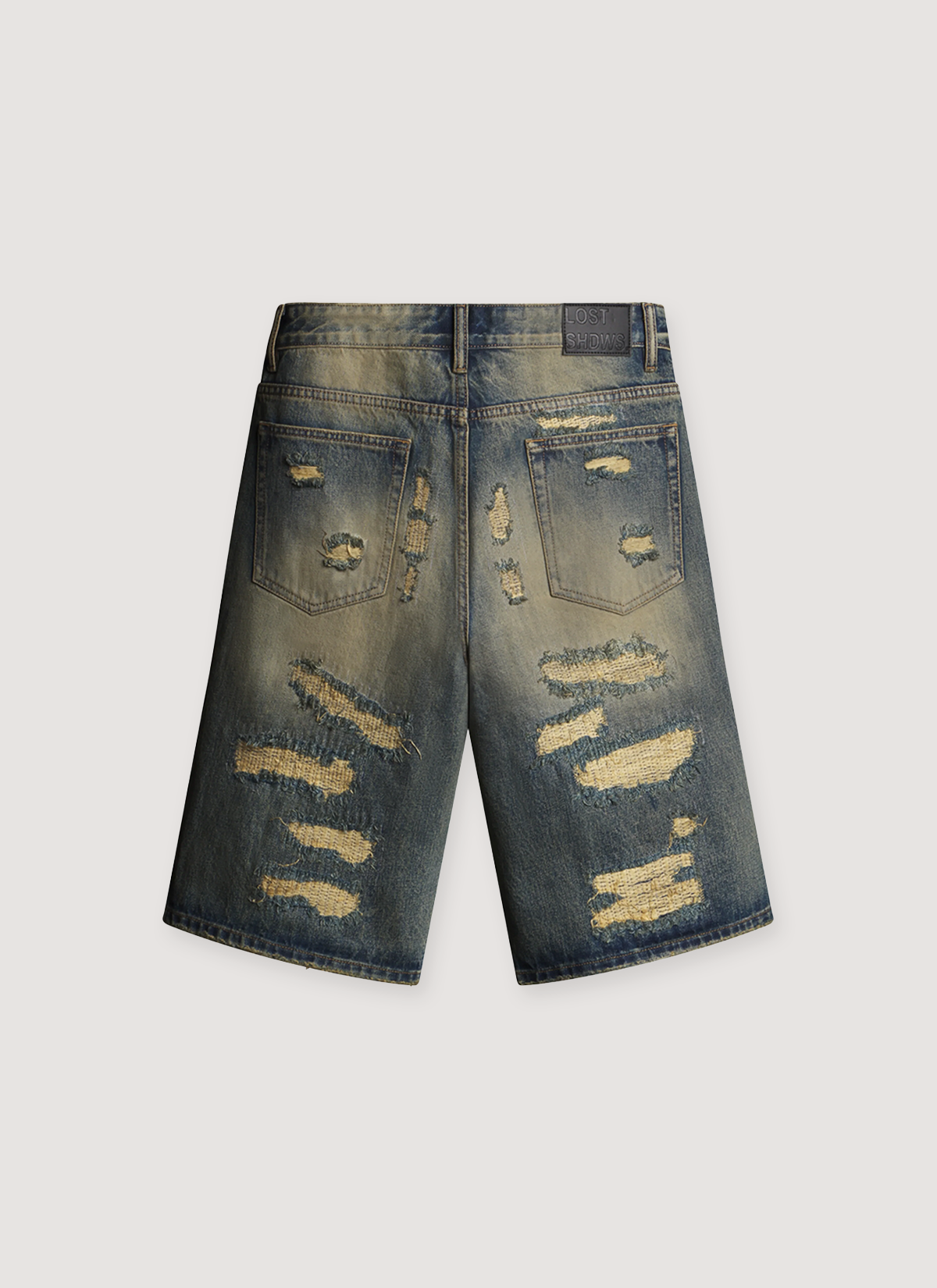 Lost SHDWS DSTRY Denim Shorts Blue Bone with repaired holes all over and faded color, back view