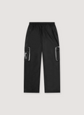 Denim Tears DT Outdoors Pants Black polyester, printed logos, 3M reflective details, cargo pockets, zipper closure, front view Denim Tears DT Outdoors Pants Black - Image 1 | Authenticated at Pieces Los Angeles