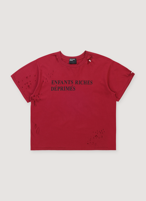 Enfants Riches Déprimés Classic Logo Tee Shirt Damaged Red with rib knit neckline, printed black text logo, distressed details, paint splatters, signature wash process, single stitch hems, front view Classic Logo Tee Damaged Red - Authenticated T-shirts | Pieces Los Angeles