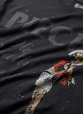 Pieces F***ed vintage black tee shirt with paint splatter and vintage graphic close up view of front graphic and text Pieces F***ed Tee Vintage Black - Image 3 | Authenticated at Pieces Los Angeles