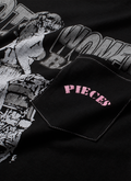 Pieces Fast Bikes Pocket Tee Shirt Vintage Black with graphic of woman riding a motorcycle, with a front pocket with pink text on it, close up view Pieces Fast Bikes Pocket Tee Vintage Black - Image 3 | Authenticated at Pieces Los Angeles
