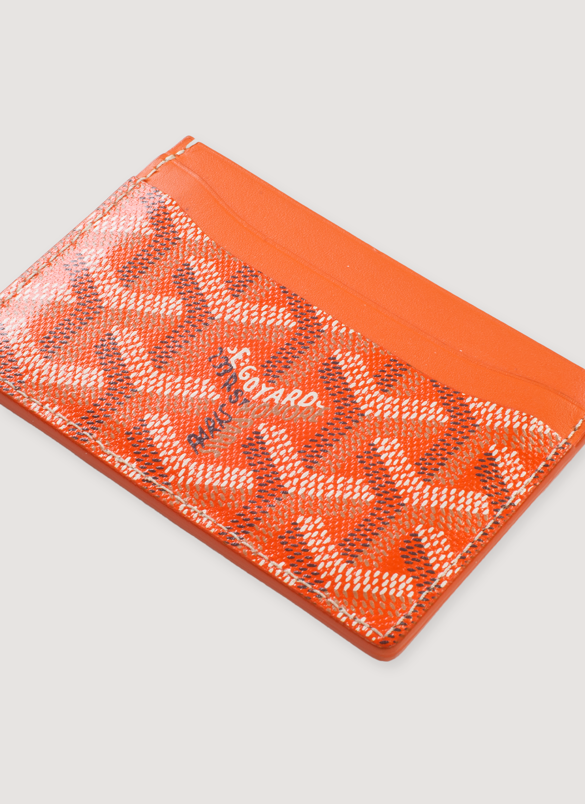 Goyard Saint-Sulpice Card Wallet Orange pattern design (Pre-Owned) 4 card slots, 1 central slot, angled view Goyard Saint-Sulpice Card Wallet Orange (Pre-Owned) - Image 3 | Authenticated at Pieces Los Angeles