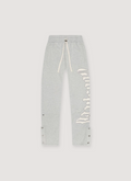Godspeed New York OG Logo Sweatpants Grey V2 with white text graphic on one of the legs, and white drawstrings, front view Godspeed New York OG Logo Sweatpants V2 - Image 1 | Authenticated at Pieces Los Angeles