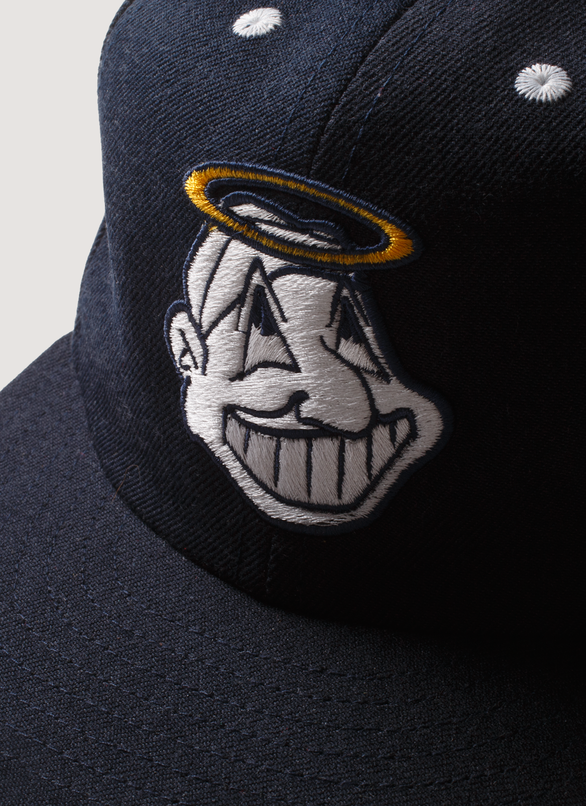 Pieces God Vs Devil Baseball Cap hat Navy Blue with a graphic of a Native American Indian head with a halo, close up of graphic Pieces God Vs Devil Baseball Cap Navy - Image 3 | Authenticated at Pieces Los Angeles