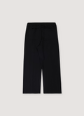 Helmut Lang Embossed Studio Joggers Black with embossed logo at front waist, elasticated waist with adjustable drawstrings, pintucked creased front, slip and back patch pockets, straight leg cut, back view Helmut Lang Embossed Studio Joggers Black - Image 2 | Authenticated at Pieces Los Angeles
