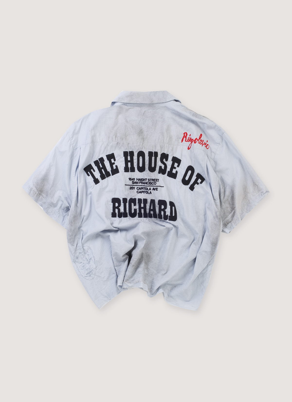 Paly Hollywood House of Richard Mechanic Shirt Baby Blue (Pre-Owned) garment dye utility work shirt with collar, single needle embroidery, chain stitched art, hand stained,distressed, raw edge hem, small logo patches, and big black text, back view Paly Hollywood House of Richard Mechanic Shirt Baby Blue (Pre-Owned) - Image 2 | Authenticated at Pieces Los Angeles
