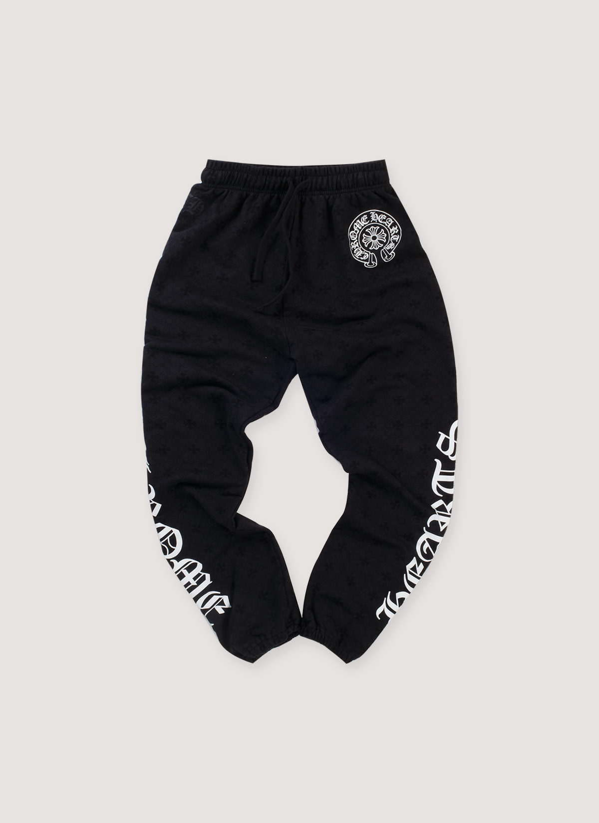 Chrome Hearts Cemetery Cross Horseshoe Sweatpants Black (Pre-Owned) with white horseshoe logo and white graphic text on the legs, front view Chrome Hearts Cemetery Cross Horseshoe Sweatpants Black (Pre-Owned) - Image 1 | Authenticated at Pieces Los Angeles