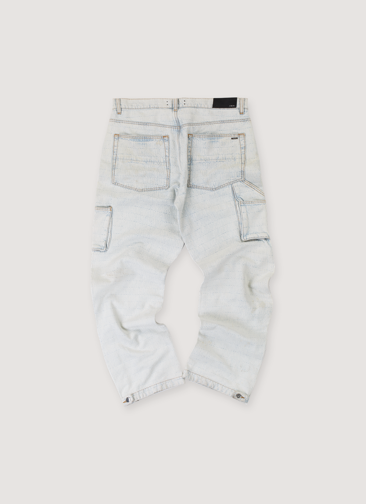 Amiri Jacquard Carpenter Pants Bleached Indigo Blue Jeans (Pre-Owned), Jacquard Amiri logo pattern, metal embellishments, leather back tab, back pockets, snap button leg opening, back view