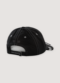 Alice Hollywood Ksubi Atelier Logo Cap Black Wax with black cross on the hat and white text on the brim, back view Alice Hollywood Ksubi Atelier Logo Cap Black Wax - Image 2 | Authenticated at Pieces Los Angeles
