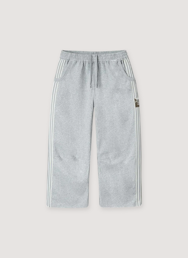 GV Gallery Lil Leon Sweatpants Grey striped side tape, woven Raspberry Hills tag, elasticated waist band, raw edge ankle opening, side pockets, front view Lil Leon Sweatpants Grey - Authenticated Sweatpants | Pieces Los Angeles