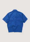 Chrome Hearts Matty Boy Chomper Patch Mechanic Button Up Shirt Blue (Pre-Owned) with cow, calf, and lamb leather, chomper patch, .925 silver buttons, .925 silver pocket detail, back view Chrome Hearts Matty Boy Chomper Patch Mechanic Shirt Blue (Pre-Owned) - Image 2 | Authenticated at Pieces Los Angeles