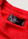 Close up view of neck tag on Pieces Mental Health Tee shirt Vintage Red front view Pieces Mental Health Tee Vintage Red - Image 5 | Authenticated at Pieces Los Angeles