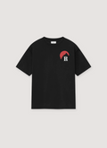 Rhude Moonlight Tee Vintage Black cotton jersey with rib knit crewneck, printed red logos, dropped shoulder, dart at back collar, front view Rhude Moonlight Tee Vintage Black - Image 1 | Authenticated at Pieces Los Angeles