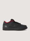 Nike Supreme Supreme SB 94 Dunk Low Black Red shoes with leather upper, rubber outsole with Zoom Air unit, padded mesh tongue, co-branded footbed with mesh collar and tongue lining, 3M reflective swoosh, metallic woven logo label on tongue, side profile view Nike Supreme SB 94 Dunk Low Black - Image 1 | Authenticated at Pieces Los Angeles