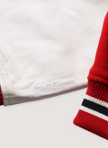 Supreme Number (N)ine Mickey Mouse Varsity Jacket Red close up view of sleeves Supreme Number (N)ine Mickey Mouse Varsity Jacket Red - Image 6 | Authenticated at Pieces Los Angeles