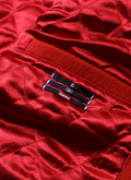 Supreme Number (N)ine Mickey Mouse Varsity Jacket Red close up viee of inside pocket Supreme Number (N)ine Mickey Mouse Varsity Jacket Red - Image 5 | Authenticated at Pieces Los Angeles