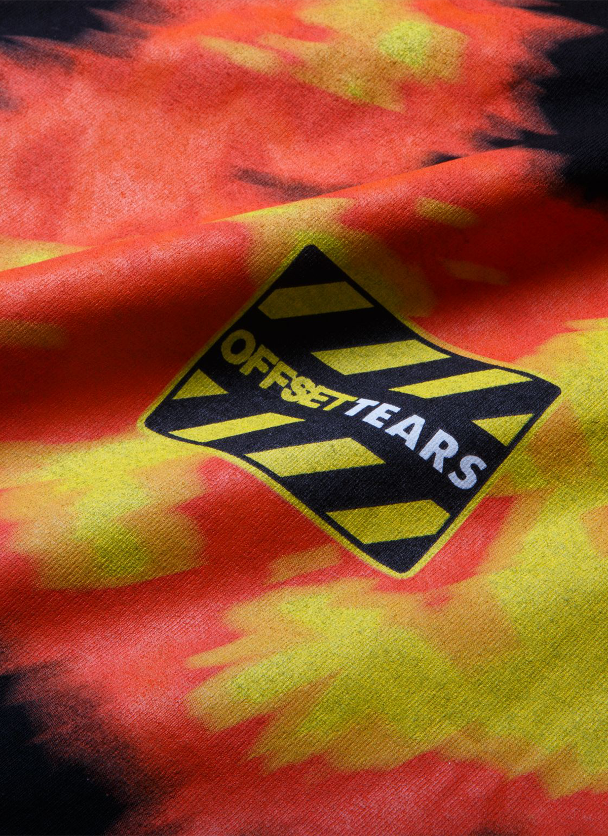 Denim Tears Offset Tee 1 Black with Orange and Yellow wreath graphic and white text, close up view of logo on back side Denim Tears Offset Tee 1 Black - Image 4 | Authenticated at Pieces Los Angeles