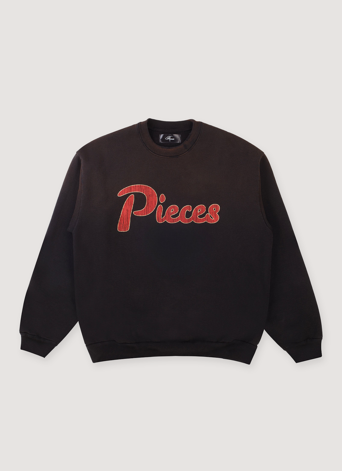 Pieces Paradise Crewneck Sweater Rusted Black with faded look and red Pieces logo, front view