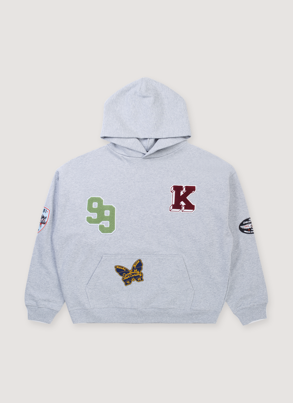 Ksubi Patched Ekcess Sweatshirt Grey Marle Hoodie with numbers, letters, and patch graphics all over, front view Ksubi Patched Ekcess Sweatshirt Grey Marle - Image 1 | Authenticated at Pieces Los Angeles