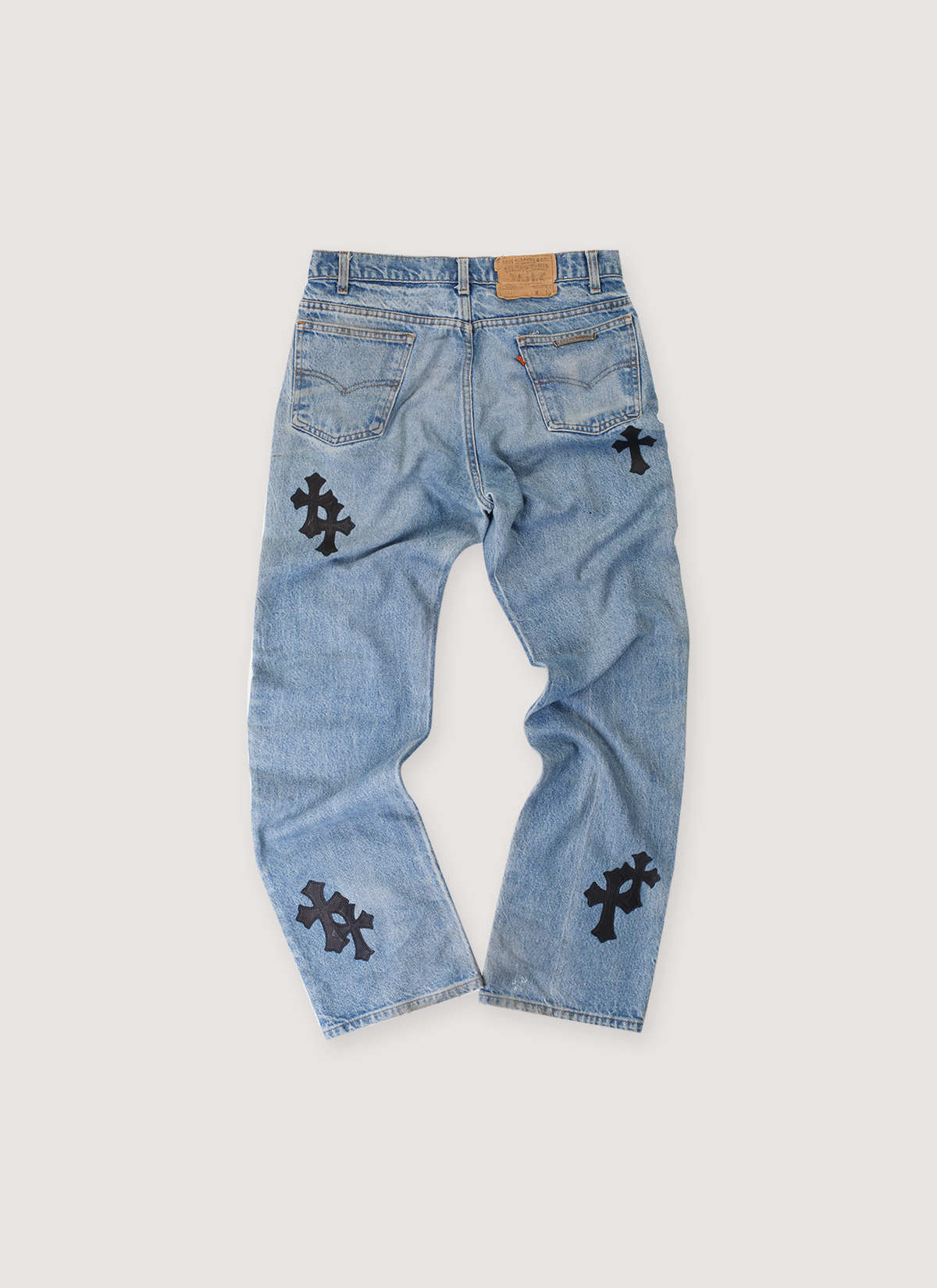 Chrome Hearts Levi's Orange Tab 517 Cross Patch Denim Indigo (Pre-Owned) with lambskin leather patches, .925 silver button, scroll and rivers, pebbled leather black label tag, black crosses paches, back view Chrome Hearts Levi's Orange Tab 517 Cross Patch Denim Indigo (Pre-Owned) - Image 2 | Authenticated at Pieces Los Angeles