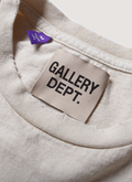 Gallery Dept. Protect Your Neck Tee Vintage White up close view of neck and tag Gallery Dept. Protect Your Neck Tee Vintage White - Image 4 | Authenticated at Pieces Los Angeles