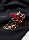 Pieces Repair Pleated Sweatpants Vintage Black with Japanese style repair stitch work, close up view of orange and red stitchwork patchwork  Pieces Repair Pleated Sweatpants Vintage Black - Image 4 | Authenticated at Pieces Los Angeles